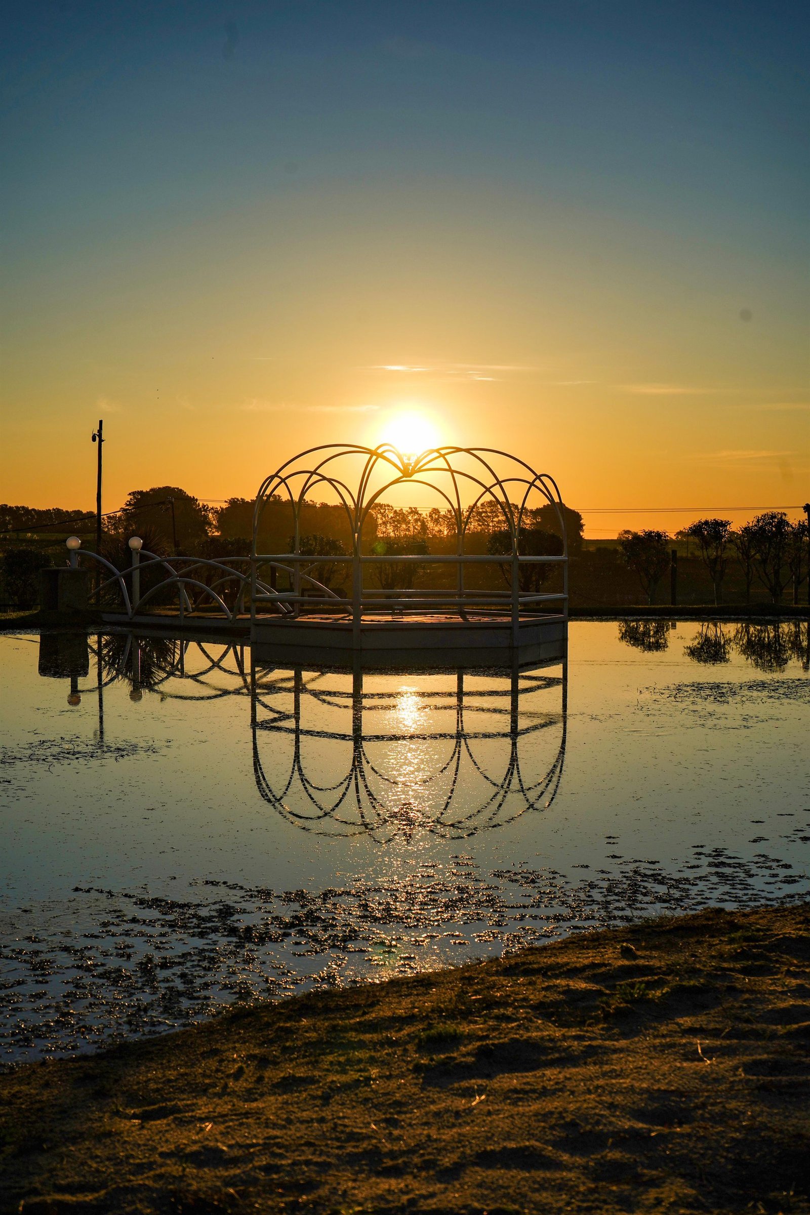 Girl in dress in a gazebo